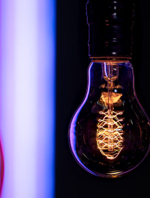 Close up of a burning lamp on a blurred dark background.